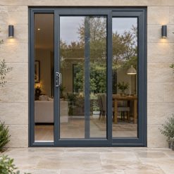 Anthracite Grey uPVC 2 pane sliding patio door on a house in daylight