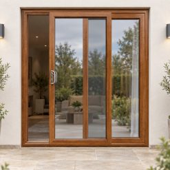 Golden Oak uPVC 2 pane sliding patio door on a house in daylight