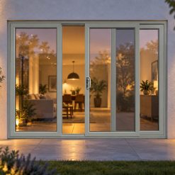 Agate Grey uPVC 3 pane sliding patio door lit up in the evening