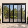 Black uPVC 3 pane sliding patio door fitted to the back of a house