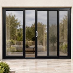 Black uPVC 3 pane sliding patio door on a house in daylight