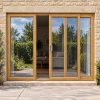 Irish Oak uPVC 3 pane sliding patio door fitted to the back of a house