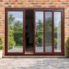Rosewood uPVC 3 pane sliding patio door fitted to the back of a house