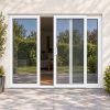 White uPVC 3 pane sliding patio door fitted to the back of a house