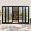 Black uPVC 4 pane sliding patio door fitted to the back of a house