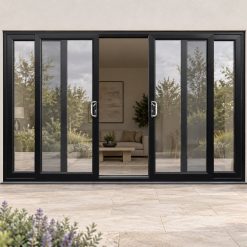 Black uPVC 4 pane sliding patio door on a house in daylight