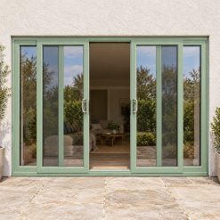 Chartwell Green uPVC 4 pane sliding patio door fitted to the back of a house