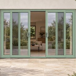 Chartwell Green uPVC 4 pane sliding patio door on a house in daylight