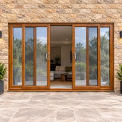 Golden Oak uPVC 4 pane sliding patio door fitted to the back of a house