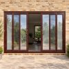 Rosewood uPVC 4 pane sliding patio door fitted to the back of a house