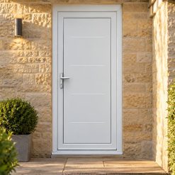 Full Panel uPVC Single Door – Flintmore Solid on a stone house