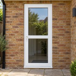 Fully Glazed uPVC Single Door with Midrail by a garden path
