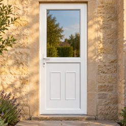 Half Glazed uPVC Single Door – Clinton Panel on a stone house