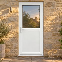 Half Glazed uPVC Single Door – Flat Panel on a stone house