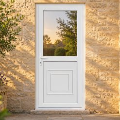 Half Glazed uPVC Single Door – Reagan Panel on a stone house