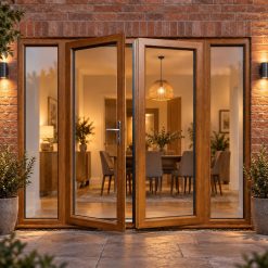 Golden Oak French Doors with Side Panels lit up in the evening