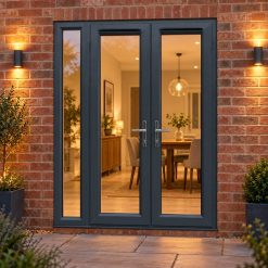 1490mm x 2090mm - Grey-on-White uPVC French Doors with Narrow Side Panel lit up in the evening