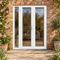 1490mm x 2090mm - White uPVC French Doors with Narrow Side Panel lit up in the evening