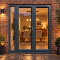 1790mm x 2090mm - Grey-on-White uPVC French Doors with Narrow Side Panel lit up in the evening