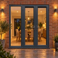 1790mm x 2090mm - Grey-on-White uPVC French Doors with Wide Side Panel lit up in the evening