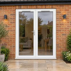 1790mm x 2090mm - White uPVC French Doors opening onto a brick patio
