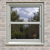 Agate Grey uPVC sliding sash window fitted in a brick house