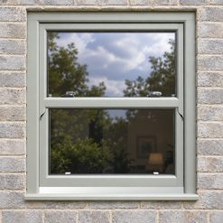 Agate Grey uPVC sliding sash window fitted in a brick house