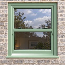 Chartwell Green uPVC sliding sash window fitted in a brick house