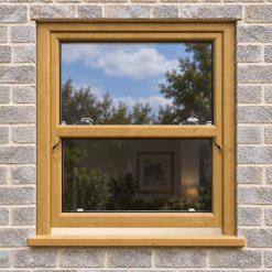 Irish Oak uPVC sliding sash window fitted in a brick house