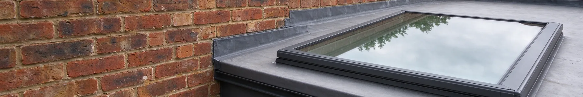 Flat glass rooflight on a flat roof extension